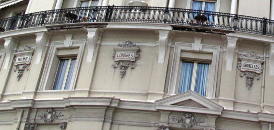 Grand city names round the arc of the Hotel De Paris.