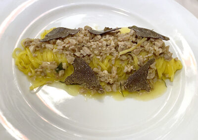 Tajarin al ragu with quail and black truffle