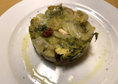 Escarole with pine nuts and raisins