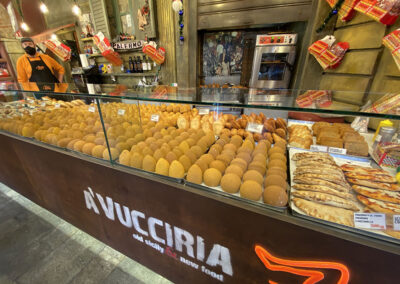 Arancini, deep-fried rice balls filled with meats, cheese, sauce