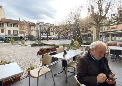 Antonio checking email in the main piazza of Stresa